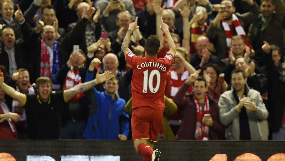 Liverpool's Brazilian midfielder Philippe Coutinho celebrates after scoring their fourth goal during the English Premier League football match between Liverpool and Everton at Anfield in Liverpool, north west England on April 20, 2016. / AFP / PAUL ELLIS / RESTRICTED TO EDITORIAL USE. No use with unauthorized audio, video, data, fixture lists, club/league logos or 'live' services. Online in-match use limited to 75 images, no video emulation. No use in betting, games or single club/league/player publications. / (Photo credit should read PAUL ELLIS/AFP/Getty Images)