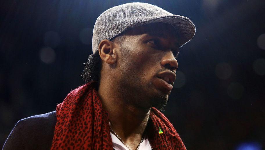 TORONTO, ON - DECEMBER 05: Footballer Didier Drogba looks on from courtside during an NBA game between the Golden State Warriors and the Toronto Raptors at the Air Canada Centre on December 05, 2015 in Toronto, Ontario, Canada. NOTE TO USER: User expressly acknowledges and agrees that, by downloading and or using this photograph, User is consenting to the terms and conditions of the Getty Images License Agreement. (Photo by Vaughn Ridley/Getty Images)