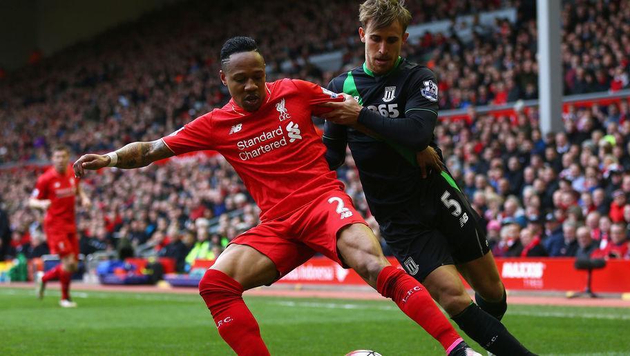 LIVERPOOL, UNITED KINGDOM - APRIL 10: Nathaniel Clyne of Liverpool holds off Marc Muniesa of Stoke City during the Barclays Premier League match between Liverpool and Stoke City at Anfield on April 10, 2016 in Liverpool, England. (Photo by Clive Brunskill/Getty Images)