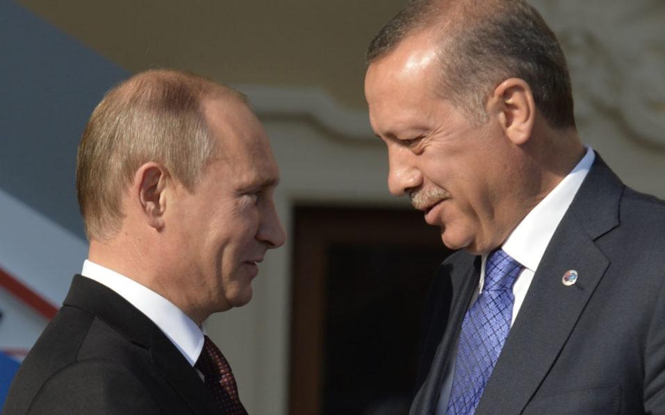 (FILES) This file photo taken on September 5, 2013 shows Russia’s President Vladimir Putin (L) welcoming Turkey’s Prime Minister Recep Tayyip Erdogan at the start of the G20 summit in Saint Petersburg. Ankara's downing of a Russian war plane over the Syrian border last November 2015 prompted rapid retaliation from Moscow and a bitter war of words between presidents Vladimir Putin and Recep Tayyip Erdogan from which there appeared no going back. But just half a year on Russia has accepted Ankara's expressions of regret over the incident and Erdogan will meet Putin in Saint Petersburg on August 8, 2016 for their first summit since the crisis erupted, in the hope of reviving the relationship. / AFP PHOTO / ERIC FEFERBERG