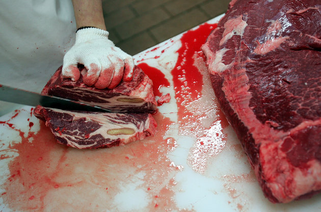 SEOUL, SOUTH KOREA - NOVEMBER 27: An employee prepares imported U.S. beef at a store on November 27, 2008 in Seoul, South Korea. The import of U.S. beef, which is sixty to seventy percent cheaper than Korean beef, had been suspended for 13 months due to the discovery of banned backbones in import shipments. (Photo by Chung Sung-Jun/Getty Images)