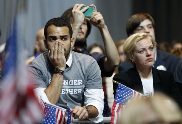 Hillary Clinton supporters react as results come in at an election night party for the Democratic presidential candidate at the Jacob K. Javits Convention Center in New York, late on Tuesday, Nov. 8, 2016. (Vernon Bryant/The Dallas Morning News via AP)