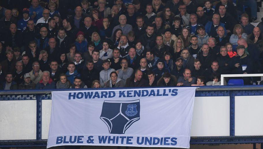 Everton fans display a banner in tribute to the late Everton manager and player Howard Kendall who died October 17, 2015 during the English Premier League football match between Everton and West Ham United at Goodison Park in Liverpool, north west England on October 30, 2016. / AFP / PAUL ELLIS / RESTRICTED TO EDITORIAL USE. No use with unauthorized audio, video, data, fixture lists, club/league logos or 'live' services. Online in-match use limited to 75 images, no video emulation. No use in betting, games or single club/league/player publications.  /         (Photo credit should read PAUL ELLIS/AFP/Getty Images)