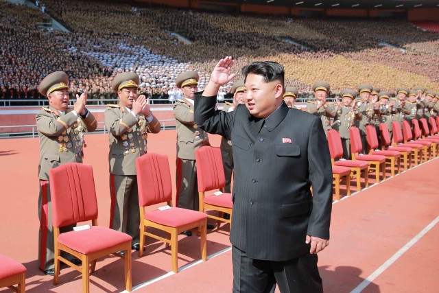 14 Oct 2015, North Korea --- (151014) -- PYONGYANG, Oct. 14, 2015 (Xinhua) -- Photo provided by Korean Central News Agency (KCNA) on Oct. 14, 2015 shows top leader of the Democratic People's Republic of Korea (DPRK) Kim Jong Un recently having a photo session with the participants in the military parade celebrating the 70th anniversary of the ruling Workers' Party of Korea (WPK) in Pyongyang, capital of the Democratic People's Republic of Korea (DPRK). (Xinhua/KCNA) --- Image by © KCNA/Xinhua Press/Corbis