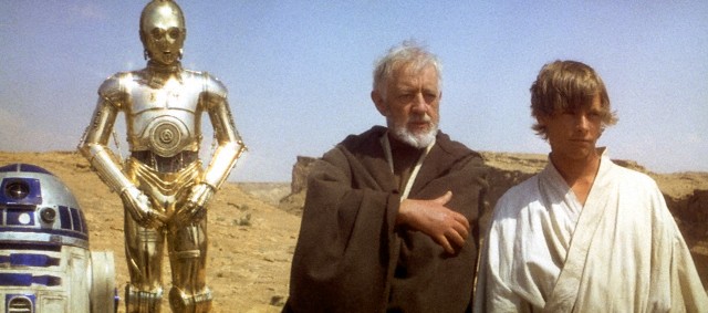 1977 --- British actors Anthony Daniels, Alec Guinness and American Mark Hamill on the set of Star Wars: Episode IV - A New Hope written, directed and produced by Georges Lucas. --- Image by © Sunset Boulevard/Corbis