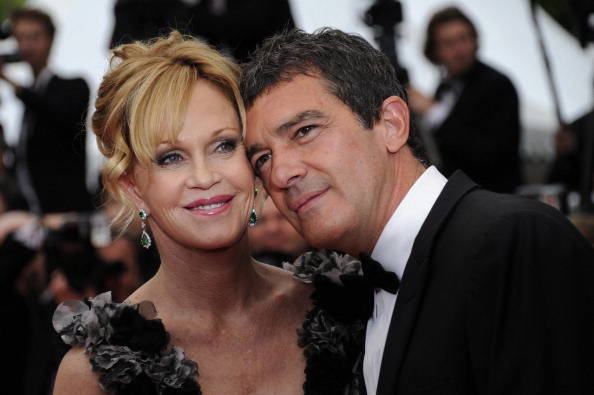 Spanish actor Antonio Banderas and his wife, US actress Melanie Griffith, pose on the red carpet before the opening ceremony and the screening of "Midnight in Paris" presented out-of-competition at the 64th Cannes Film Festival on May 11, 2011 in Cannes.     AFP PHOTO / ANNE-CHRISTINE POUJOULAT (Photo credit should read ANNE-CHRISTINE POUJOULAT/AFP/Getty Images)