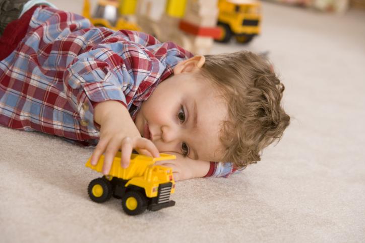 Boy-playing-with-toy-car[1]